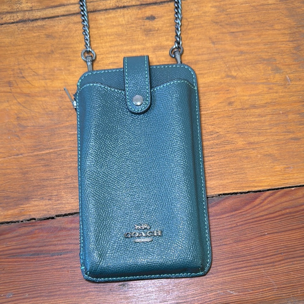 Coach North Sought Teal Crossbody Phone Pouch.
